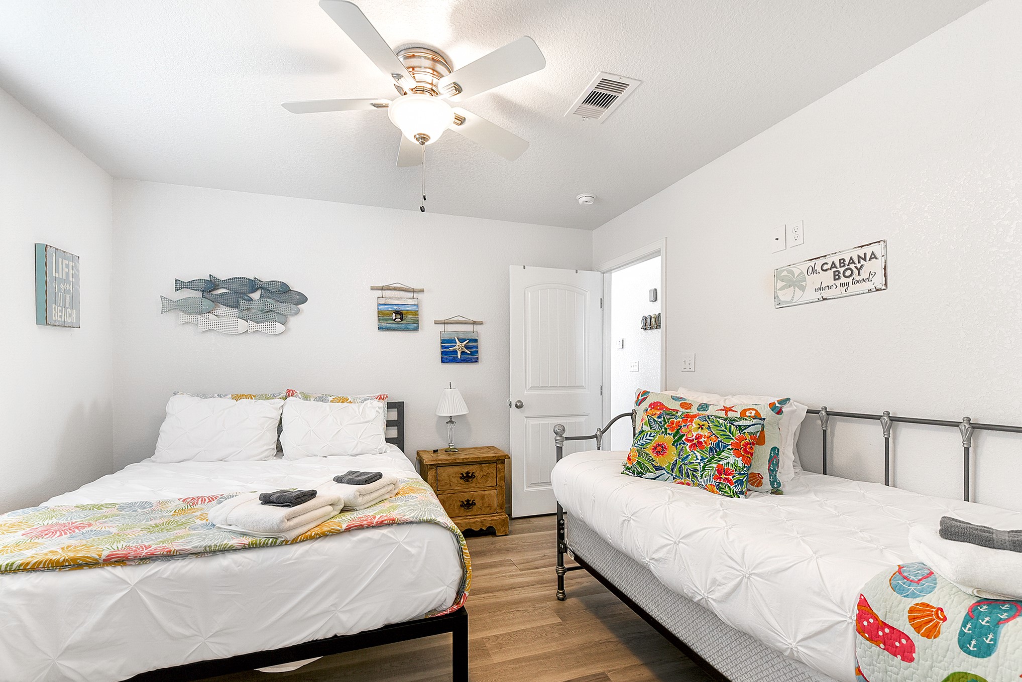 126 Nesmith Place Surfside Beach, TX 77541 - Photo 40 of 48 a bedroom with a bed and a chandelier