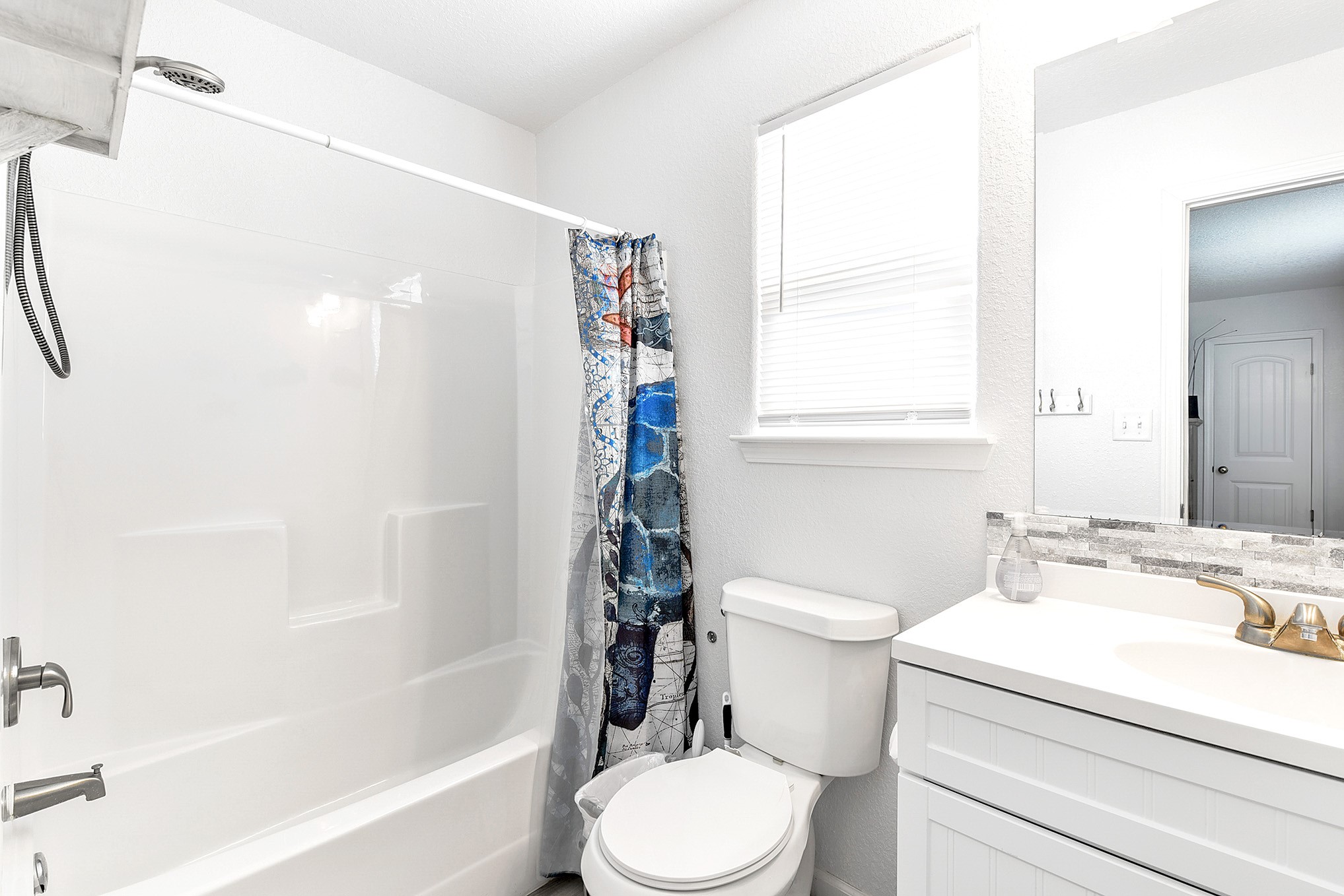 126 Nesmith Place Surfside Beach, TX 77541 - Photo 41 of 48 a bathroom with a sink a toilet and a bathtub
