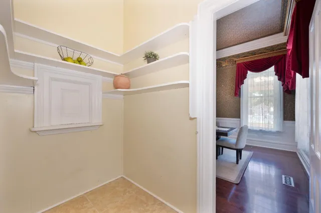 a kitchen with granite countertop stainless steel appliances and wooden cabinets