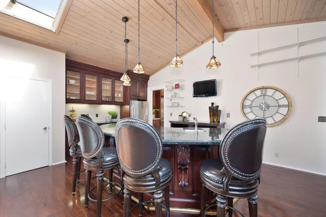 a living room with fireplace furniture and a wooden floor