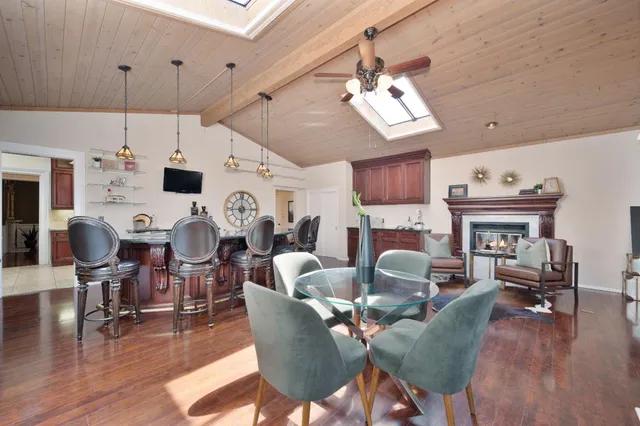 a living room with furniture a fireplace and cabinets