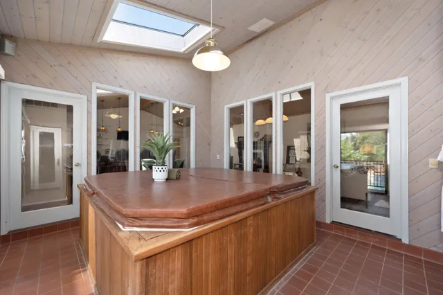 a bathroom with a bathtub and shower
