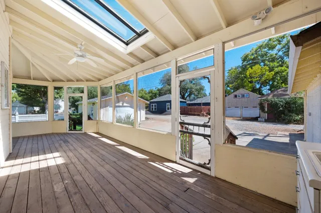 a view of a chairs and table in the balcony