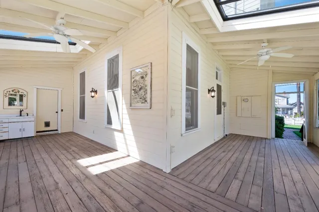 an aerial view of multiple houses with a yard