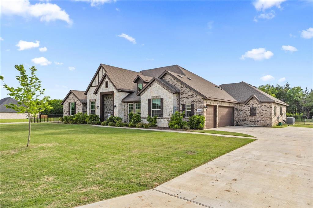 1600 Lynx Loop Forney, TX 75126 - Photo 3 of 39 3 CAR ATTACHED GARAGE WITH OVERSIZED DRIVE