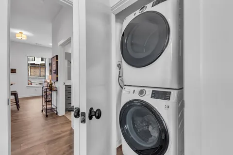 a view of a storage & utility room with a washer dryer