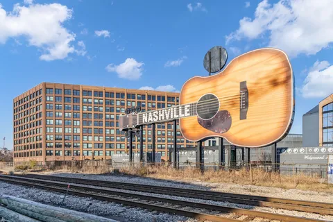 a view of a swimming pool with a table and chairs