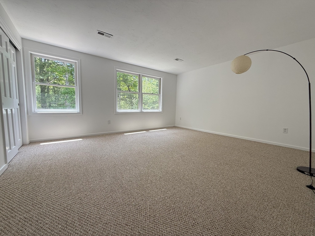 51 A Minot Avenue, Unit 1 Wareham, MA 02571 - Photo 13 of 26 an empty room with windows