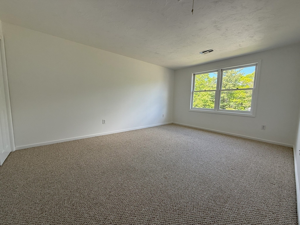 51 A Minot Avenue, Unit 1 Wareham, MA 02571 - Photo 17 of 26 an empty room with a window