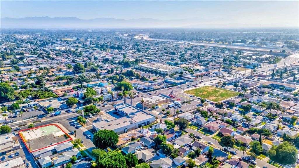 2416 East Alondra Boulevard Compton, CA 90221 - Photo 9 of 10 an aerial view of residential houses with swimming pool and outdoor space