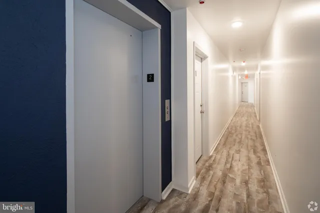 a view of a hallway with a door