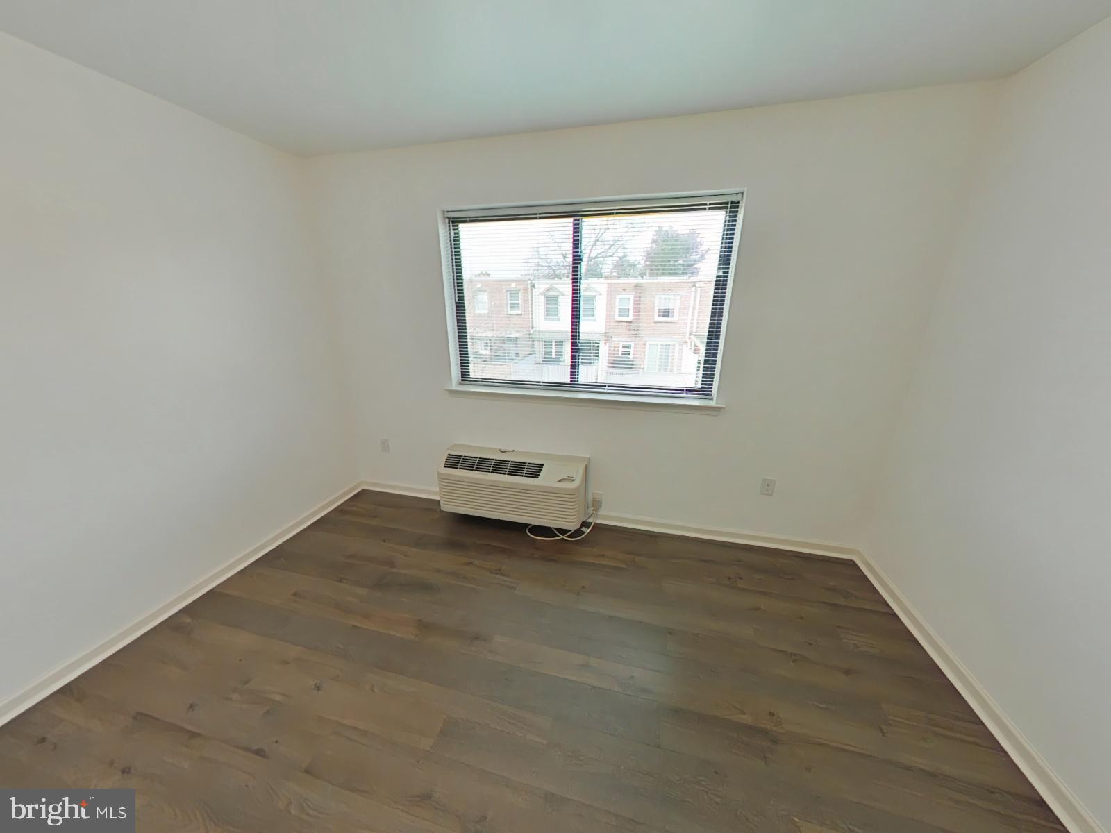 5420 Ridge Avenue, Unit 409 Philadelphia, PA 19128 - Photo 6 of 13 an empty room with a window