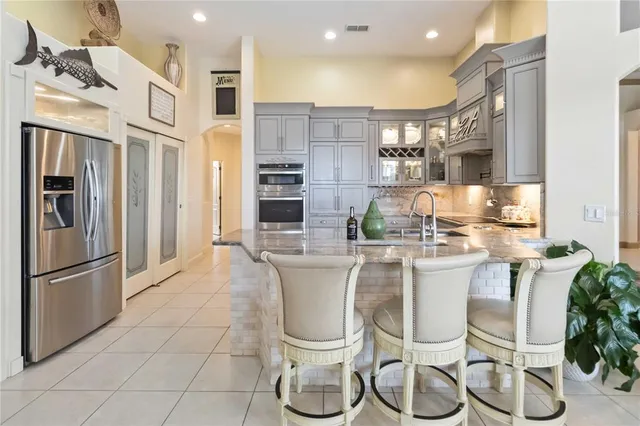 a kitchen with a table and chairs