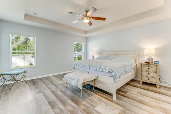 a bedroom with a bed and a chair