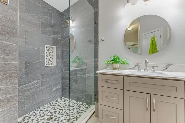 a bathroom with a sink and a mirror