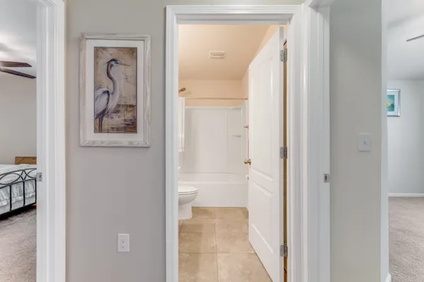 a view of a bathroom from a hallway