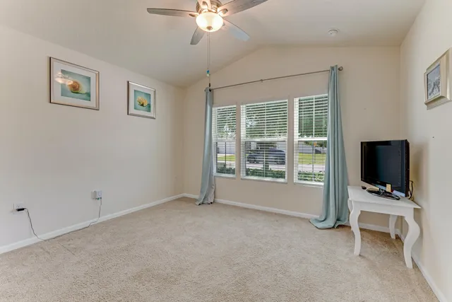 a view of room with workspace and windows