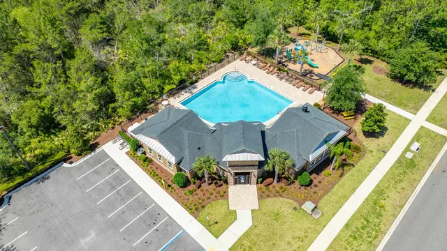 an aerial view of house with yard