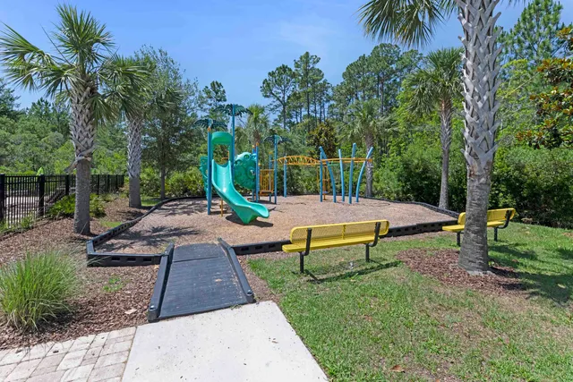 a view of a park with large trees