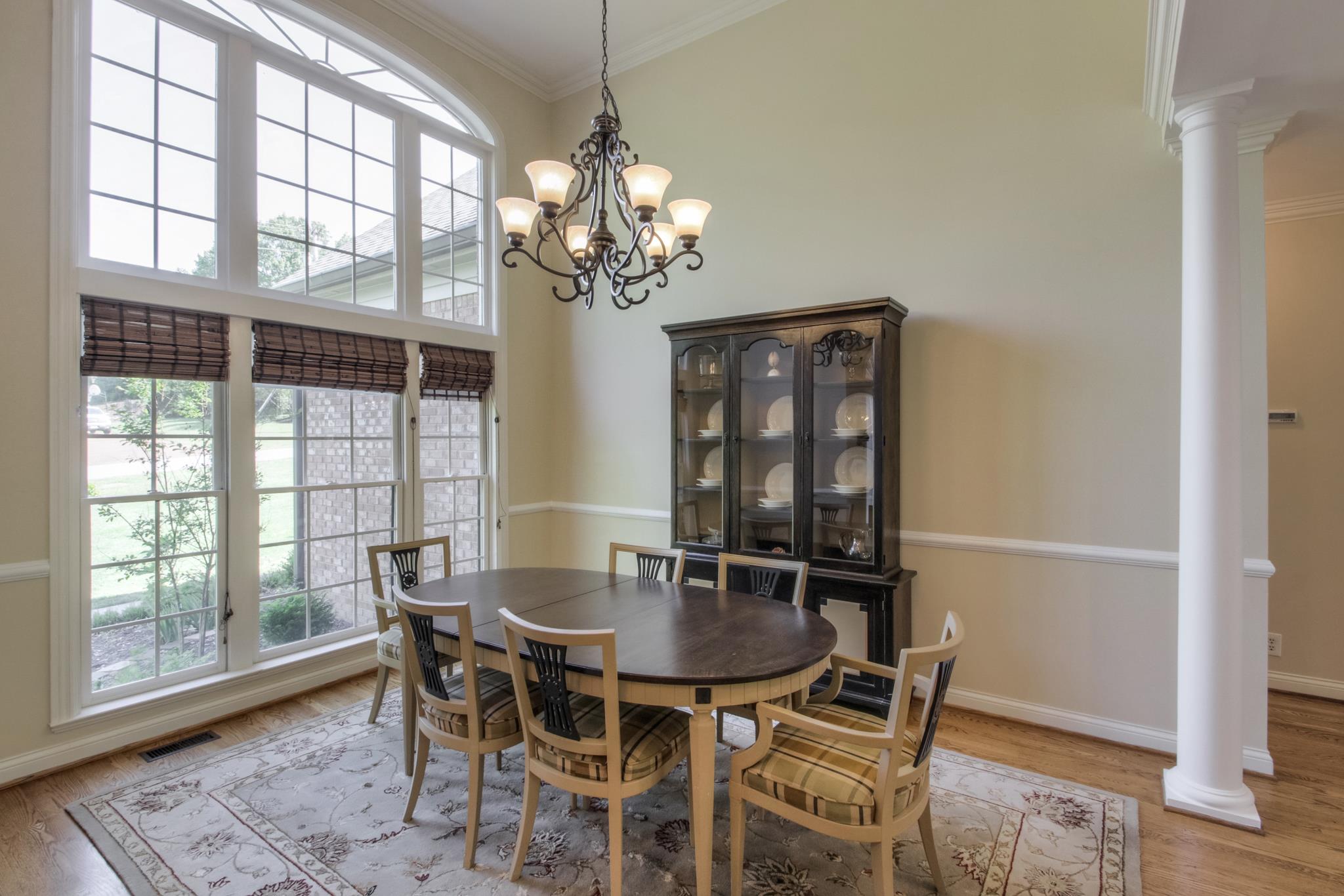 305 Monticello Road Franklin, TN 37069 - Photo 2 of 24 The Dining Room Boasts Floor To Ceiling Windows, 14 ft. Ceilings, Hardwoods, Formal Pillars, And Custom Lighting.