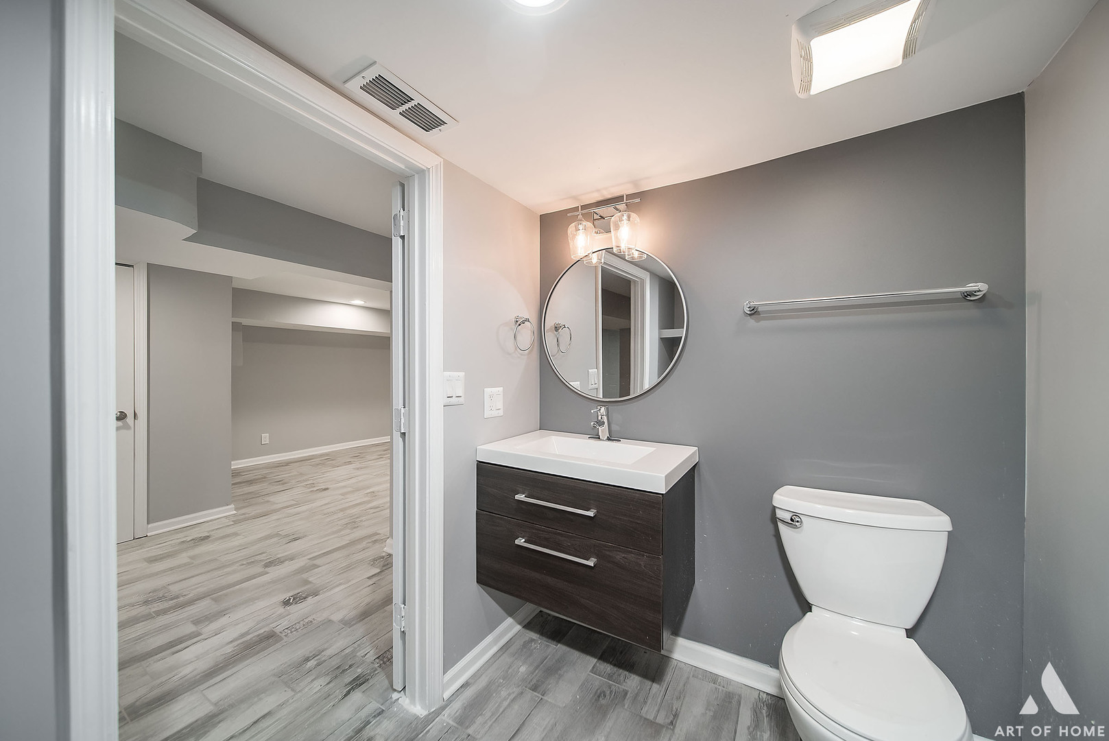7141 South Artesian Avenue Chicago, IL 60629 - Photo 23 of 31 a bathroom with a toilet a sink and mirror