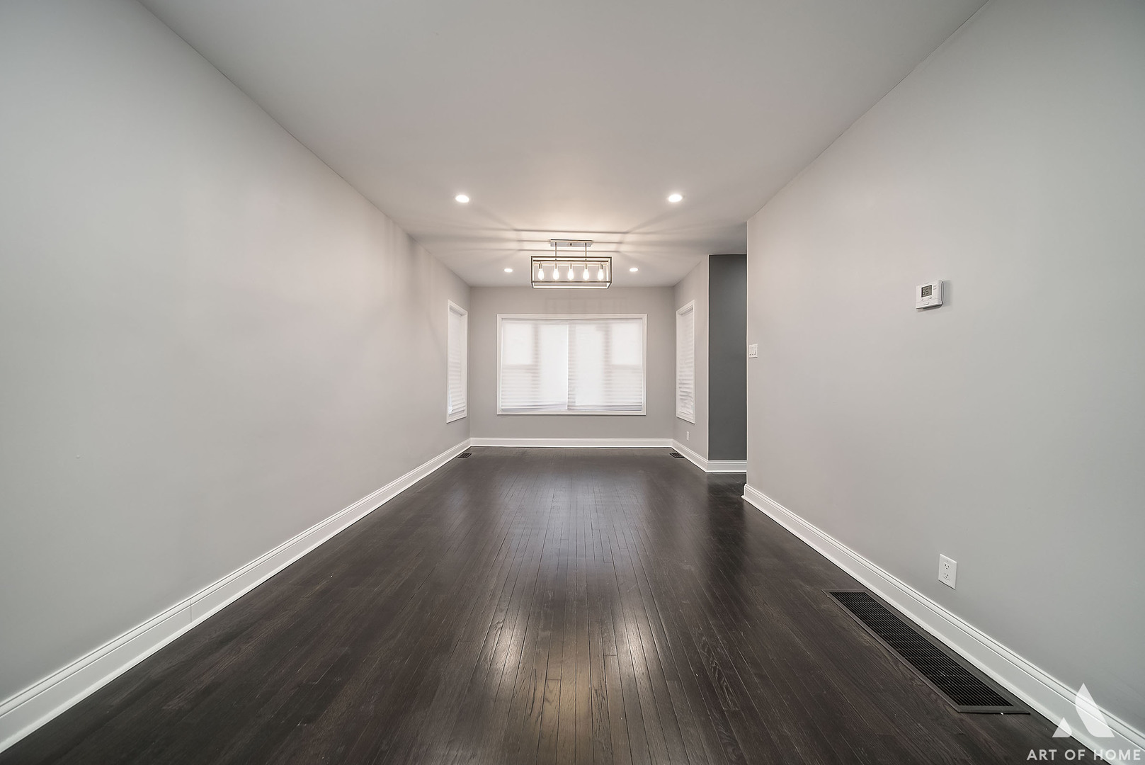 7141 South Artesian Avenue Chicago, IL 60629 - Photo 3 of 31 wooden floor in an empty room with a window