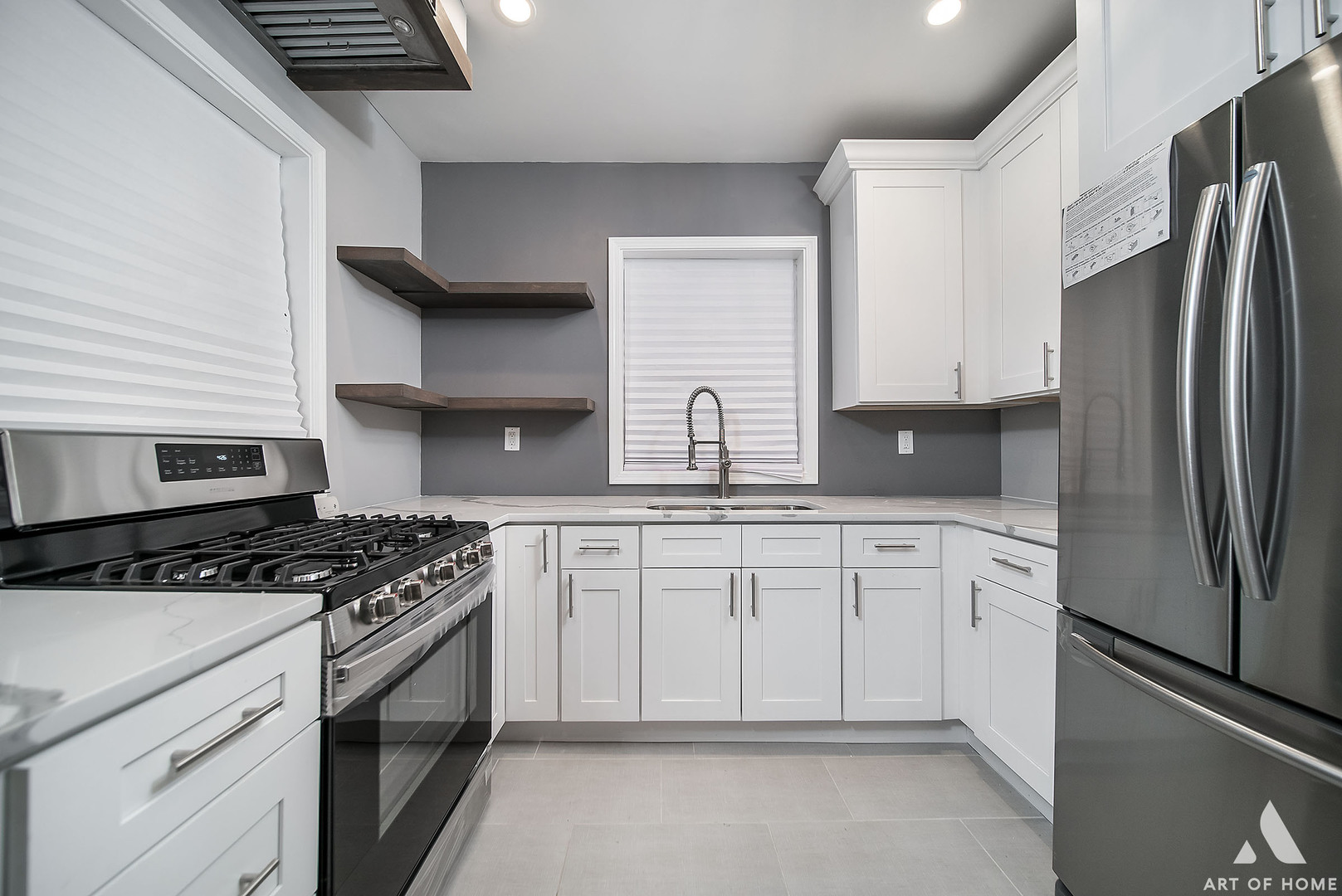 7141 South Artesian Avenue Chicago, IL 60629 - Photo 6 of 31 a kitchen with granite countertop a sink stove and refrigerator