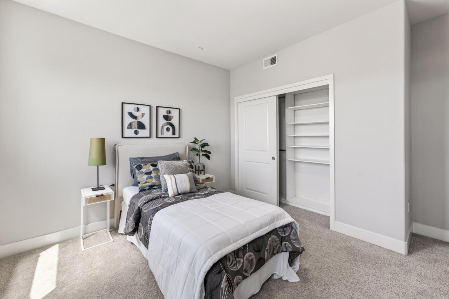 202 Market Street Milpitas, CA 95035 - Photo 13 of 30 a bedroom with a bed and painting on the wall