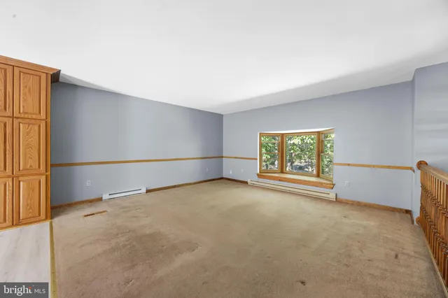 a kitchen with granite countertop cabinets stainless steel appliances and a counter space