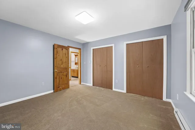 a view of storage and utility room with washer and dryer