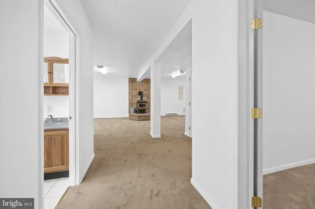 a view of a patio with table and chairs with wooden floor and fence