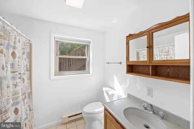 a view of a backyard with table and chairs