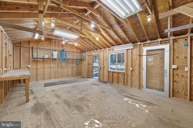 a view of a green field with lots of bushes