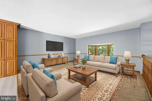 a kitchen with stainless steel appliances granite countertop a refrigerator a sink and a stove