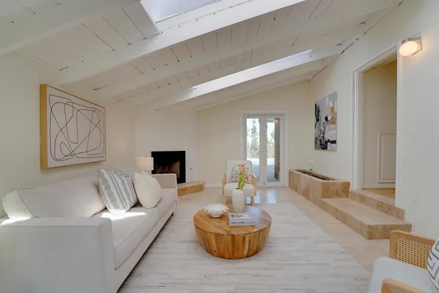 a view of a hallway with wooden floor and closet