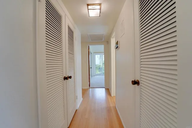a bathroom with a double vanity sink a mirror and a shower