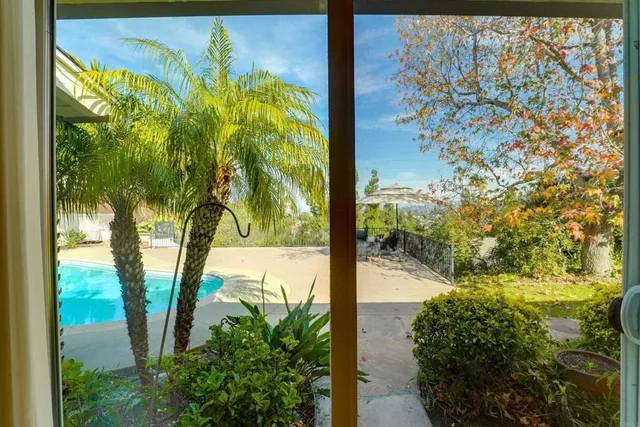 a view of a swimming pool with an outdoor space