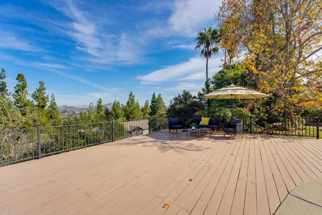 a view of a backyard with sitting area