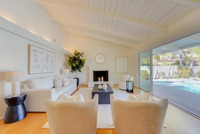 a living room with fireplace furniture and a fireplace