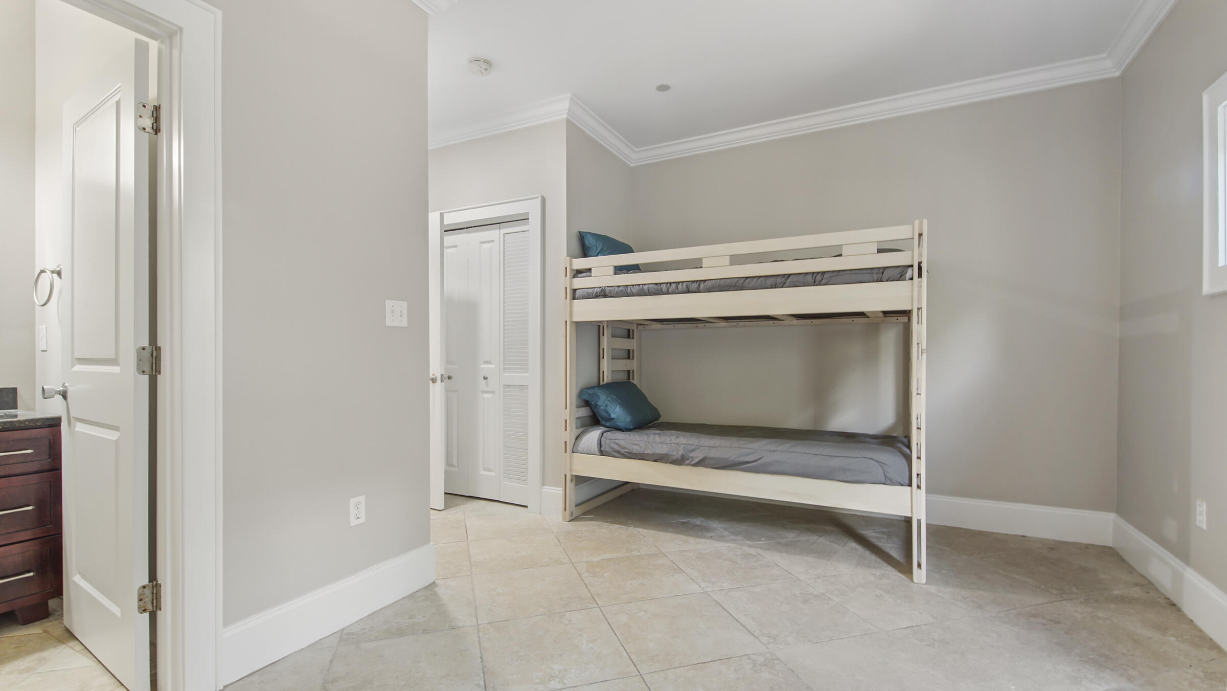 43 Coastal Grove Way, Unit 5 Santa Rosa Beach, FL 32459 - Photo 14 of 56 a bedroom with a bed and a cabinets