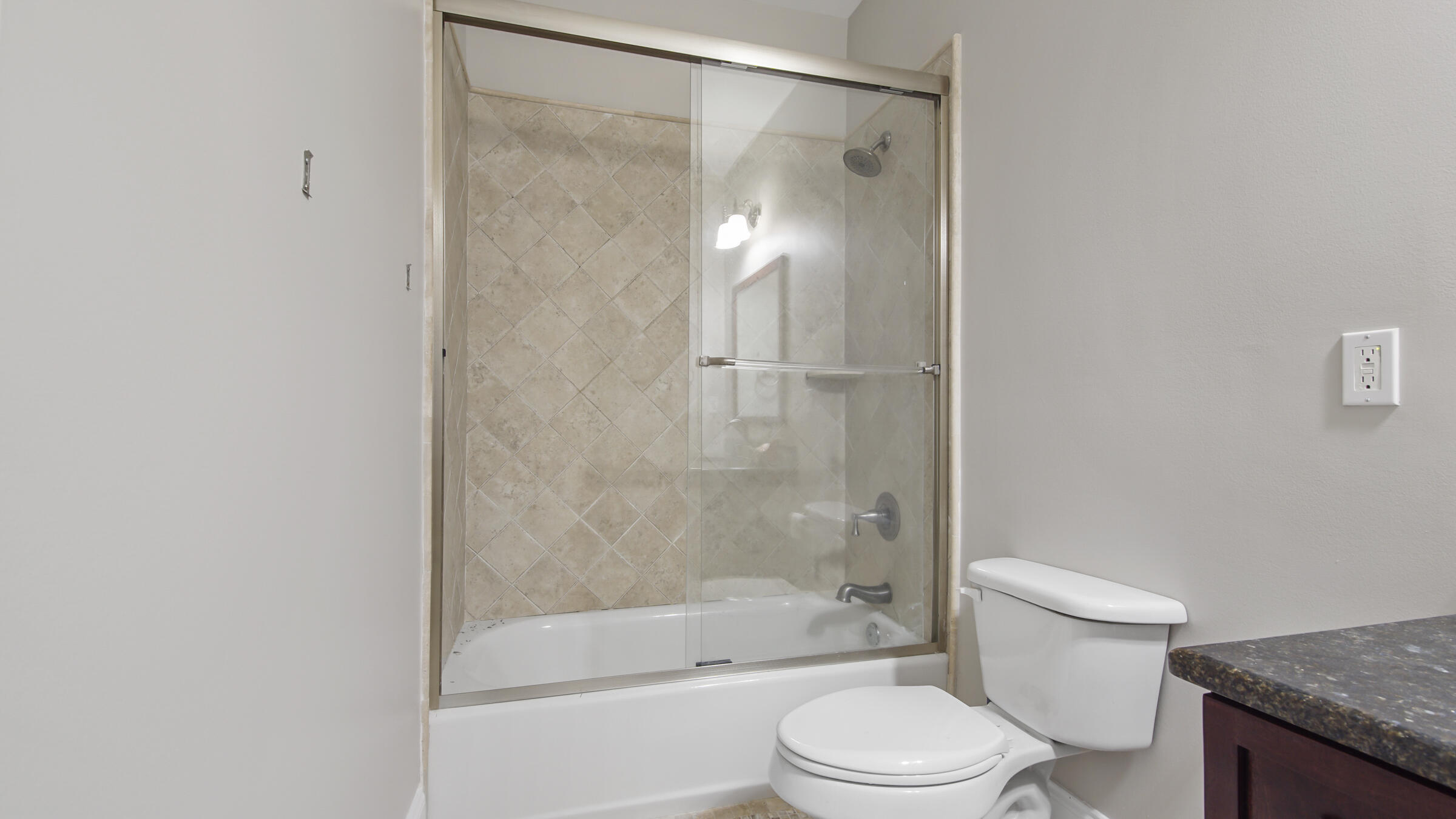 43 Coastal Grove Way, Unit 5 Santa Rosa Beach, FL 32459 - Photo 17 of 56 a bathroom with a granite countertop sink toilet and shower