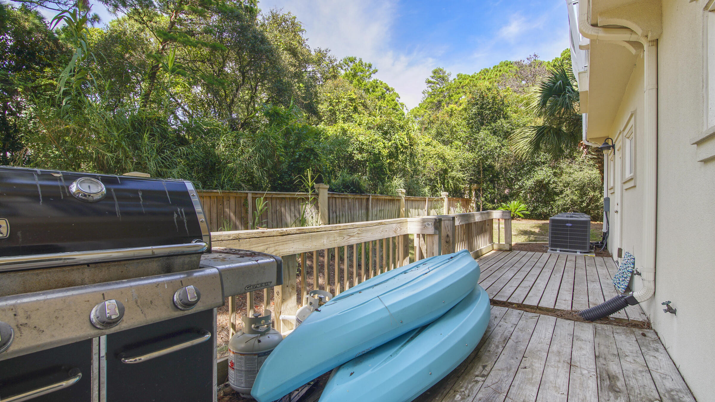 43 Coastal Grove Way, Unit 5 Santa Rosa Beach, FL 32459 - Photo 19 of 56 a view of a roof deck with wooden floor and fence
