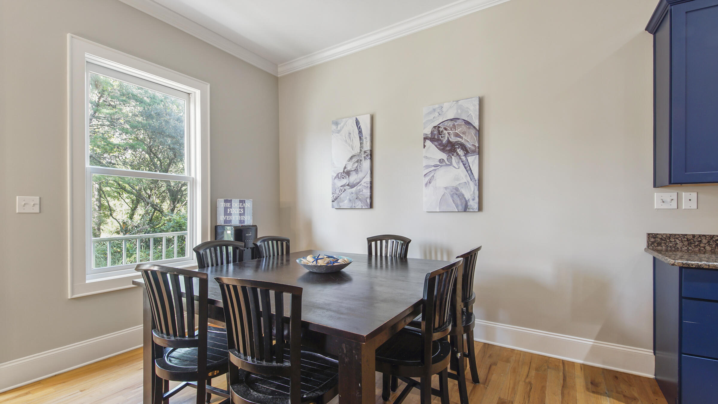 43 Coastal Grove Way, Unit 5 Santa Rosa Beach, FL 32459 - Photo 23 of 56 a dining room with furniture and wooden floor