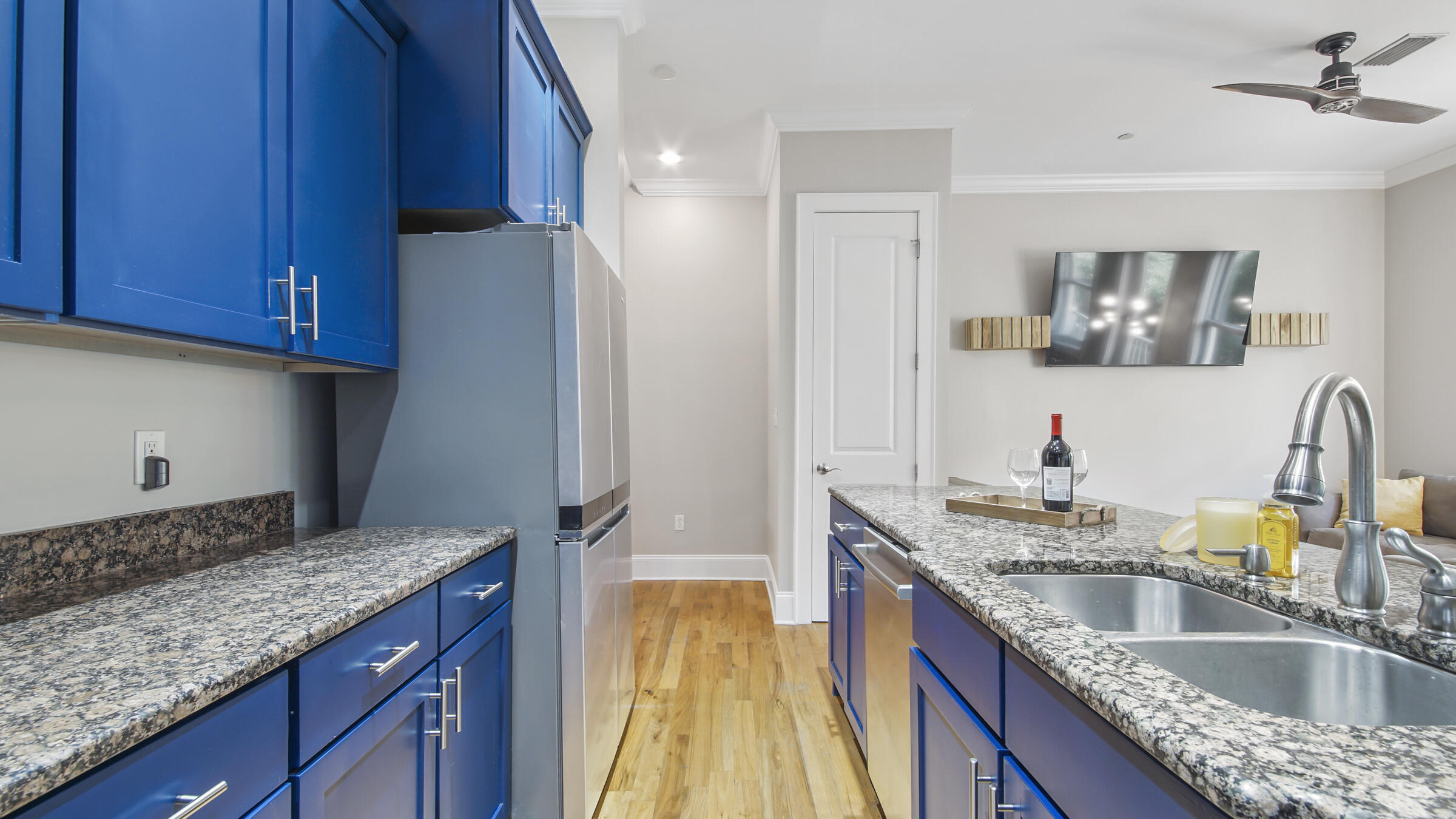 43 Coastal Grove Way, Unit 5 Santa Rosa Beach, FL 32459 - Photo 26 of 56 a kitchen with granite countertop a sink a counter space and cabinets