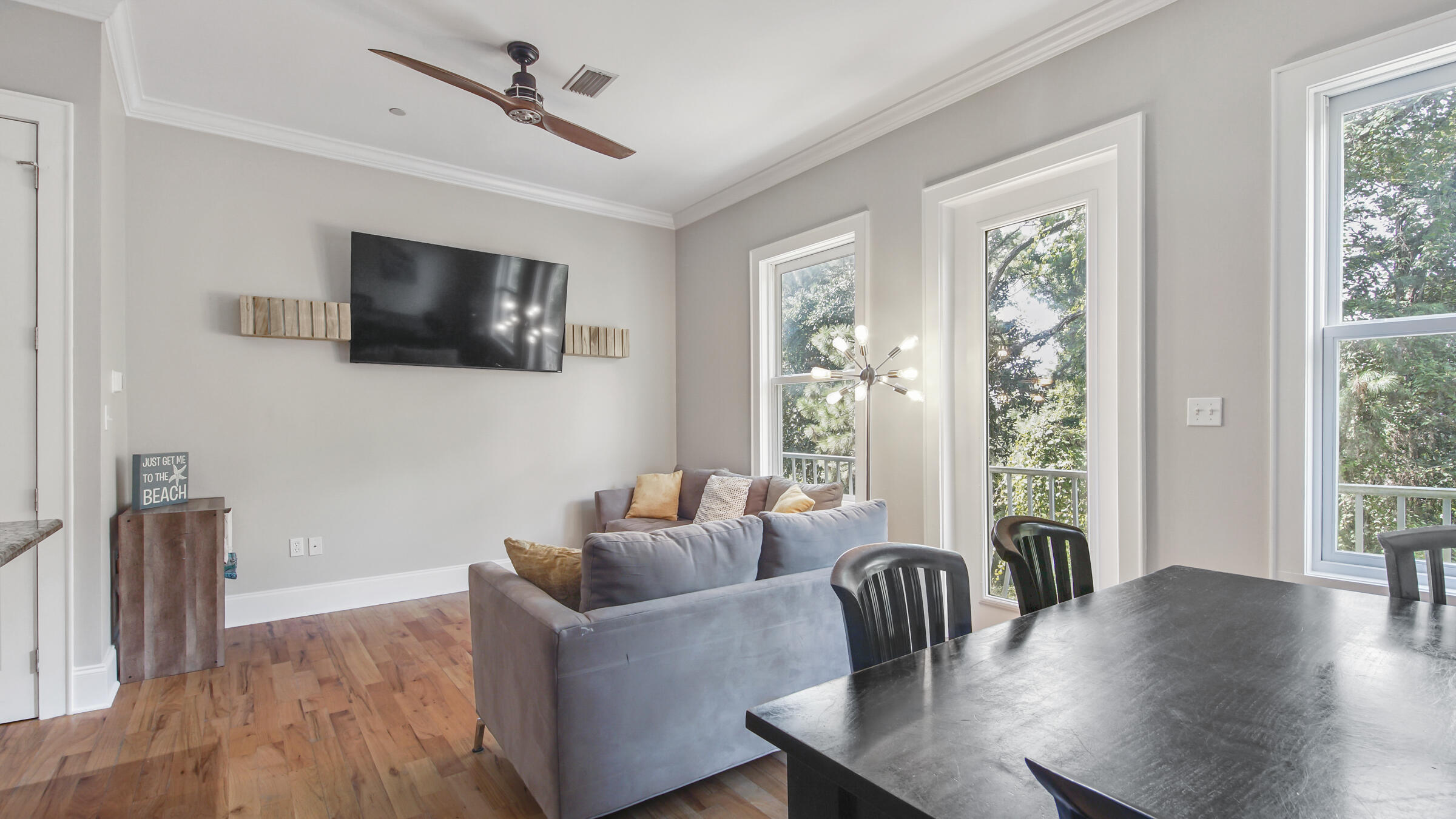 43 Coastal Grove Way, Unit 5 Santa Rosa Beach, FL 32459 - Photo 30 of 56 a living room with furniture and a flat screen tv