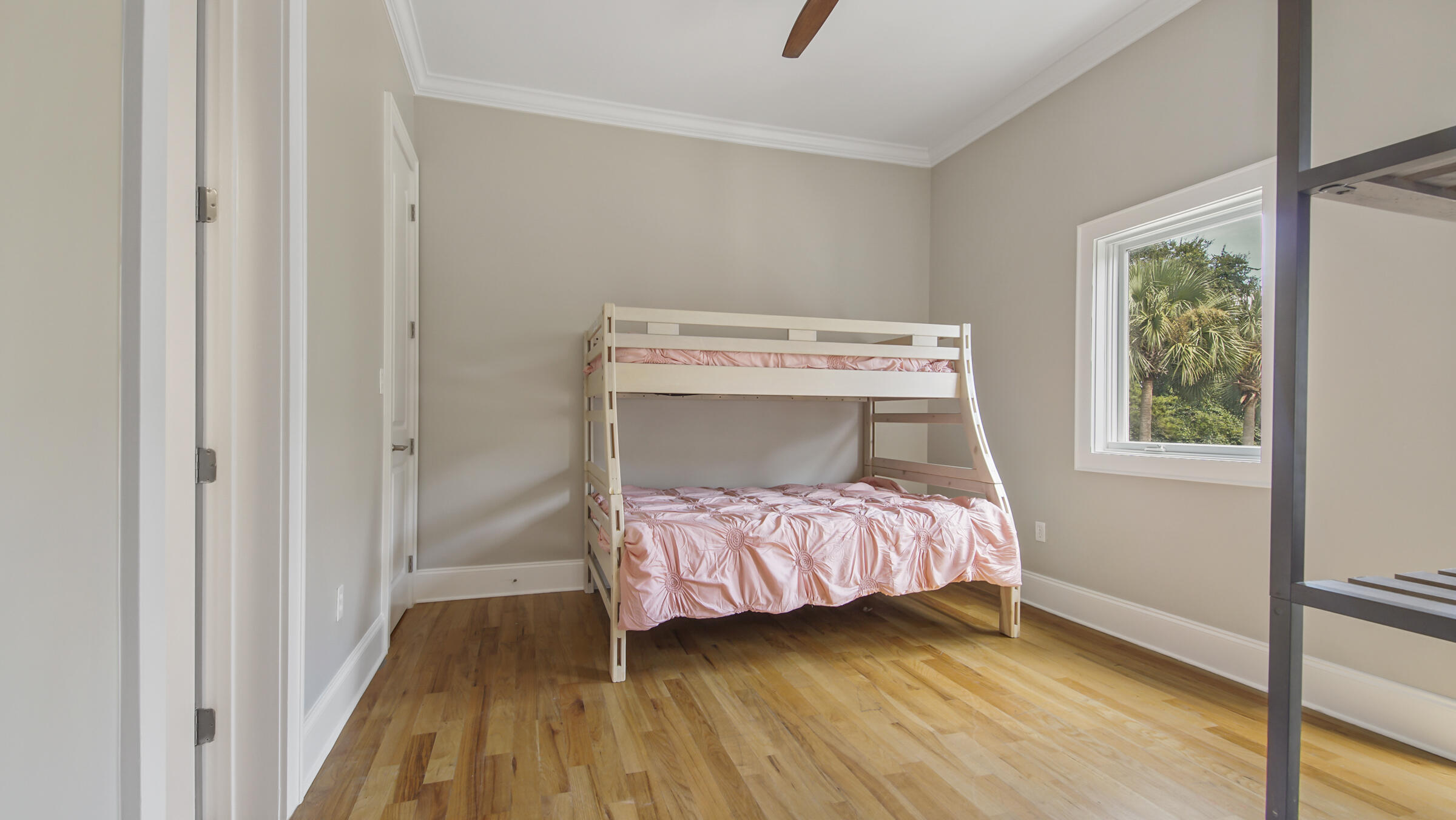 43 Coastal Grove Way, Unit 5 Santa Rosa Beach, FL 32459 - Photo 32 of 56 a bedroom with a bed and wooden floor