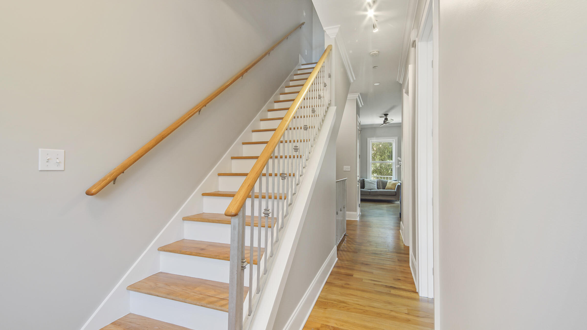 43 Coastal Grove Way, Unit 5 Santa Rosa Beach, FL 32459 - Photo 36 of 56 a view of a hallway with wooden floor and staircase