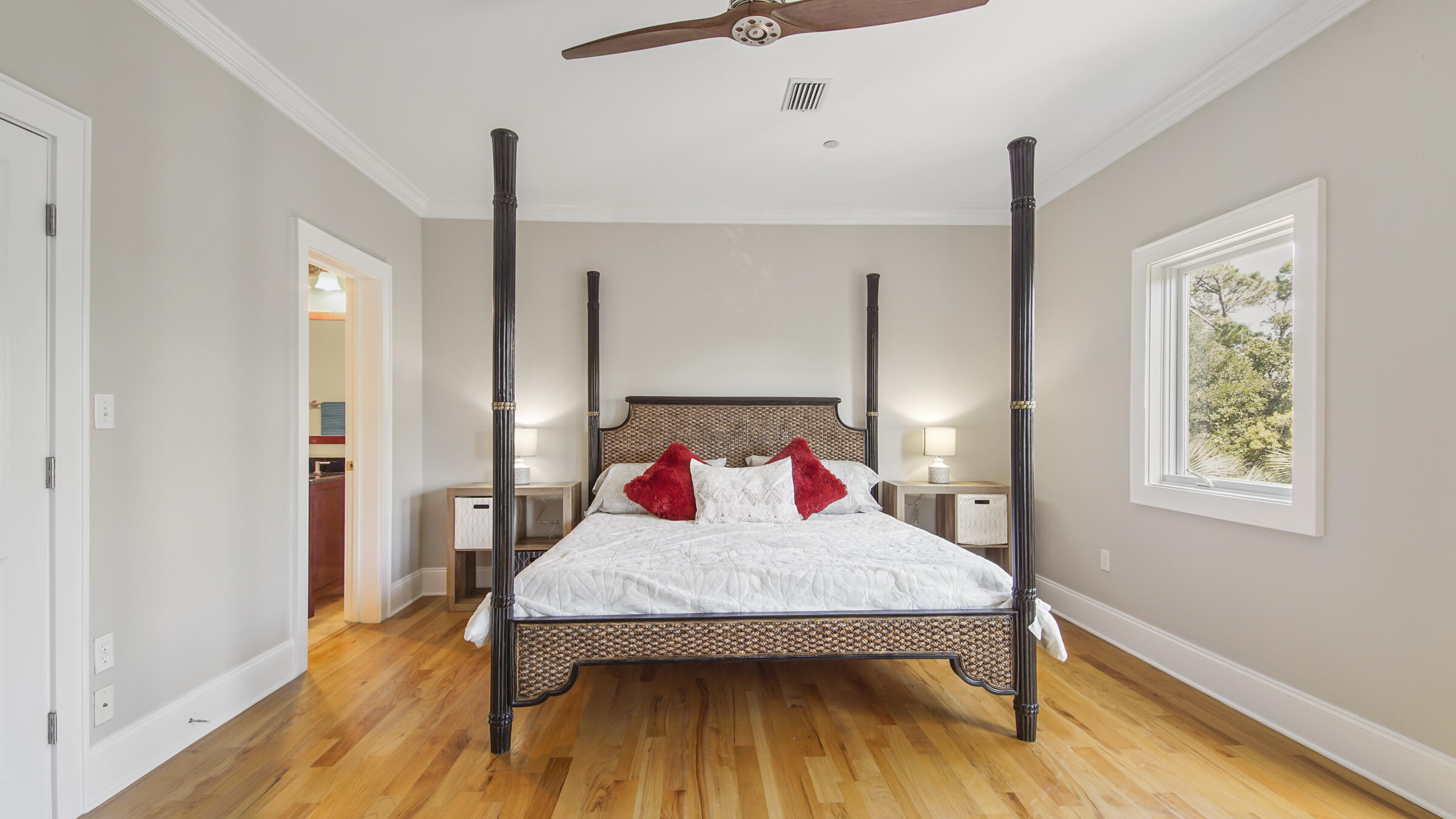 43 Coastal Grove Way, Unit 5 Santa Rosa Beach, FL 32459 - Photo 37 of 56 a view of a bedroom with wooden floor and a window