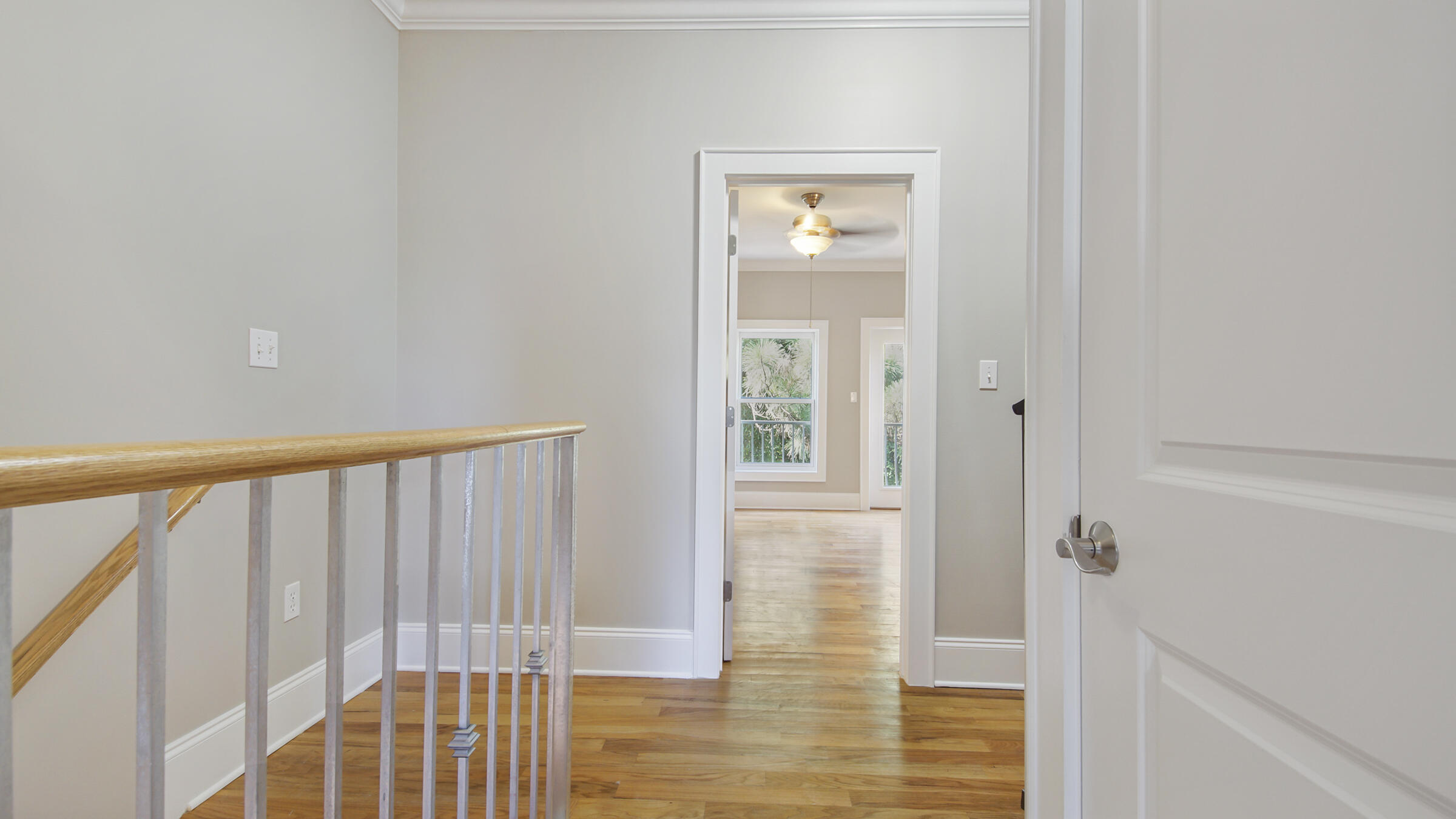 43 Coastal Grove Way, Unit 5 Santa Rosa Beach, FL 32459 - Photo 40 of 56 a view of a hallway with wooden floor and entryway
