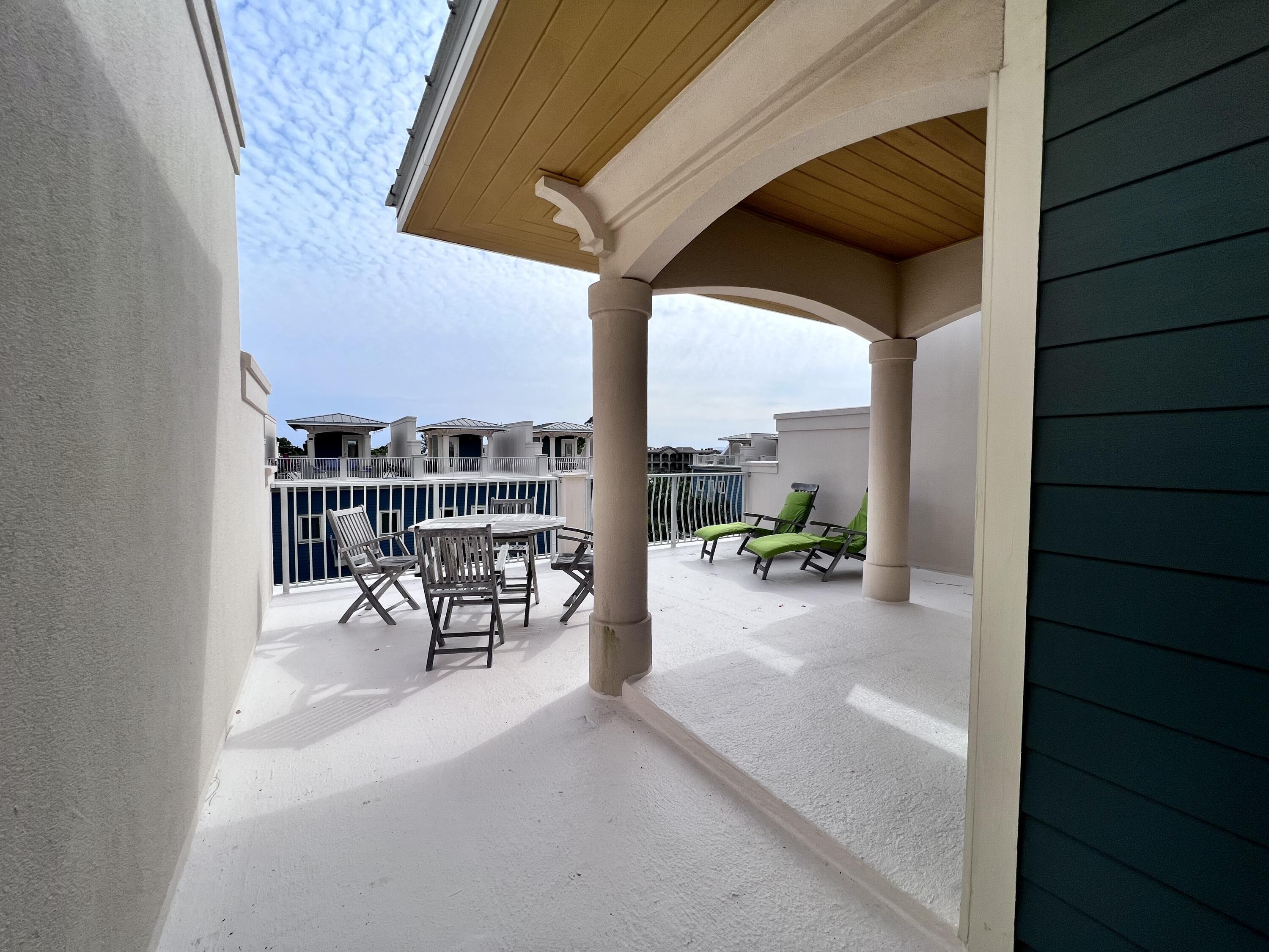 43 Coastal Grove Way, Unit 5 Santa Rosa Beach, FL 32459 - Photo 49 of 56 a view of a outdoor space with porch and furniture
